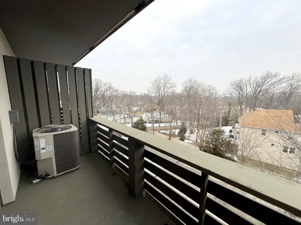 a view of balcony with furniture