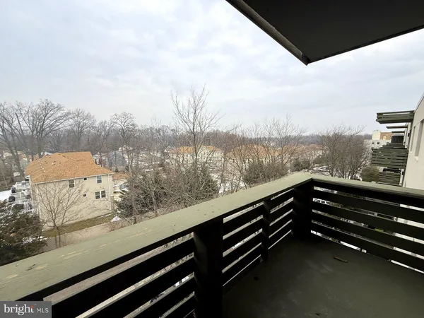 a view of balcony with furniture