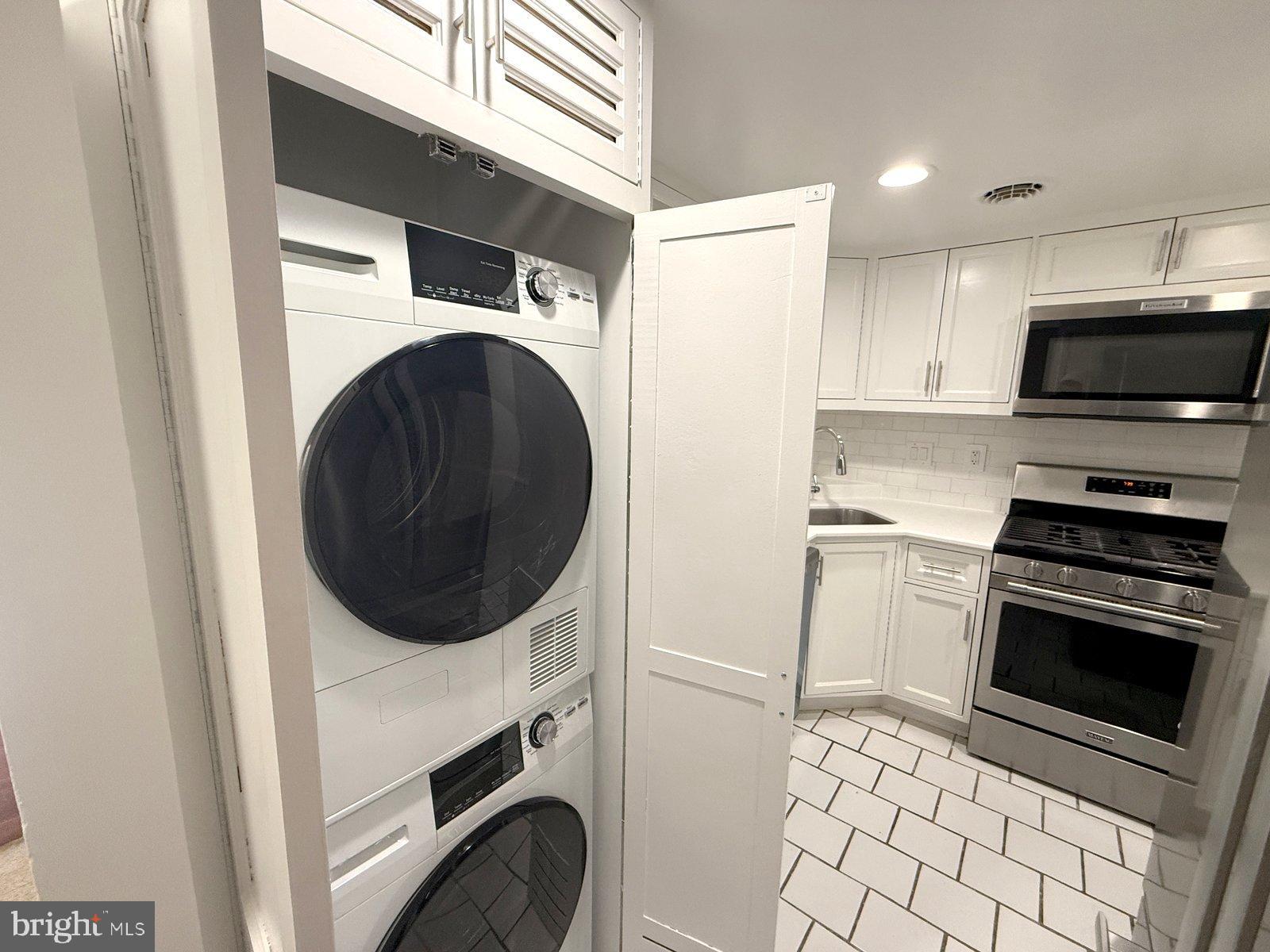 606 Cooper Landing Road, Unit B6L Cherry Hill, NJ 08002 - Photo 3 of 14 a kitchen with a stove top oven and cabinets