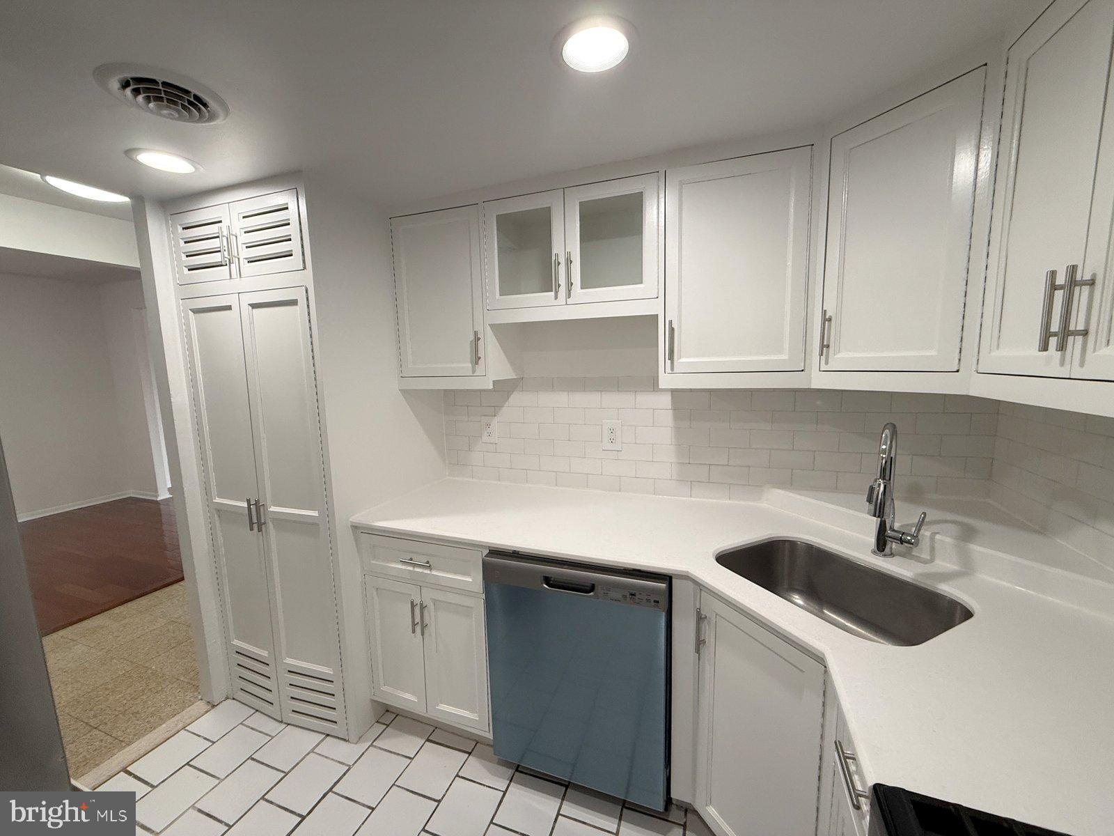 606 Cooper Landing Road, Unit B6L Cherry Hill, NJ 08002 - Photo 4 of 14 a kitchen with a sink and cabinets