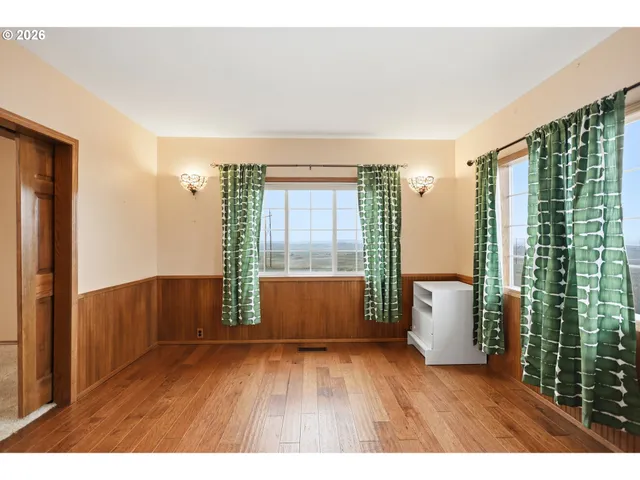 a workspace with furniture and wooden floor