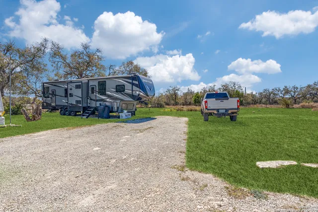 a view of yard with outdoor seating and green space