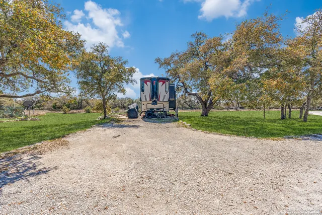 a house view with a backyard space