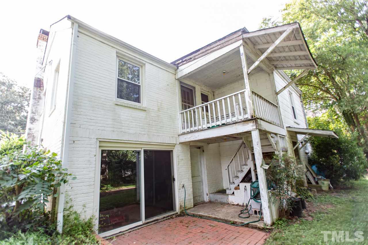 803 Brooks Avenue Raleigh, NC 27607 - Photo 8 of 11 a view of a house with a yard and potted plants