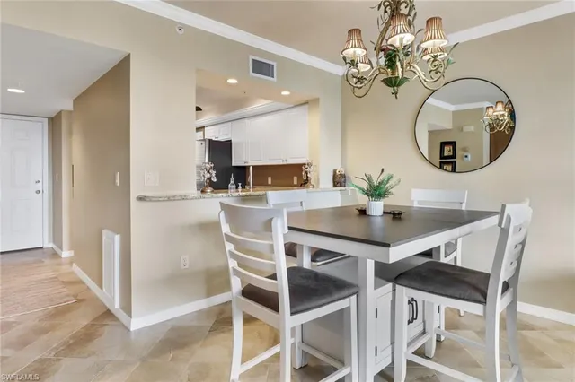 a kitchen with a table and chairs in it