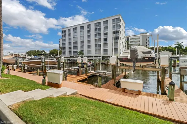 a view of a lake with couches and city view