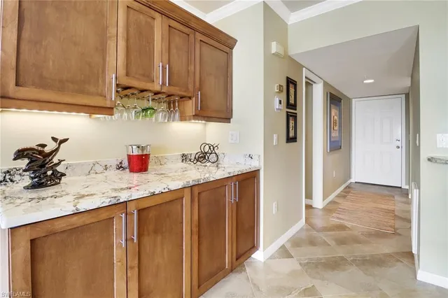 a kitchen with stainless steel appliances granite countertop a sink and cabinets