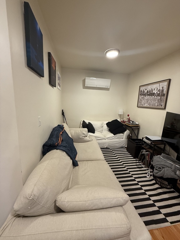 a bedroom with a bed and couch
