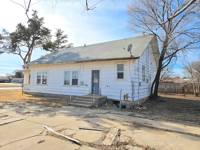 a view of a yard covered in snow