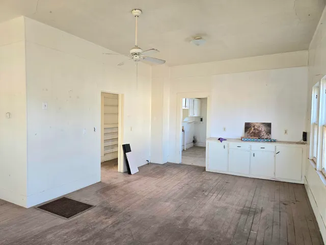 a view of a kitchen with a sink and cabinet area