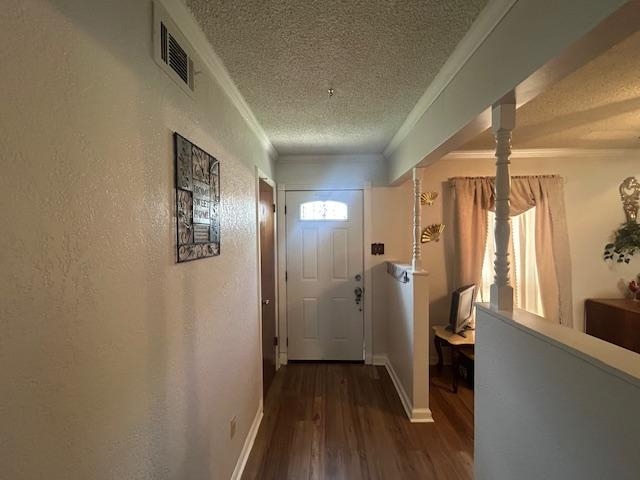3934 Kerwin Drive Memphis, TN 38128 - Photo 5 of 15 Corridor featuring crown molding, a textured wall, a textured ceiling, visible vents, and wood finished floors