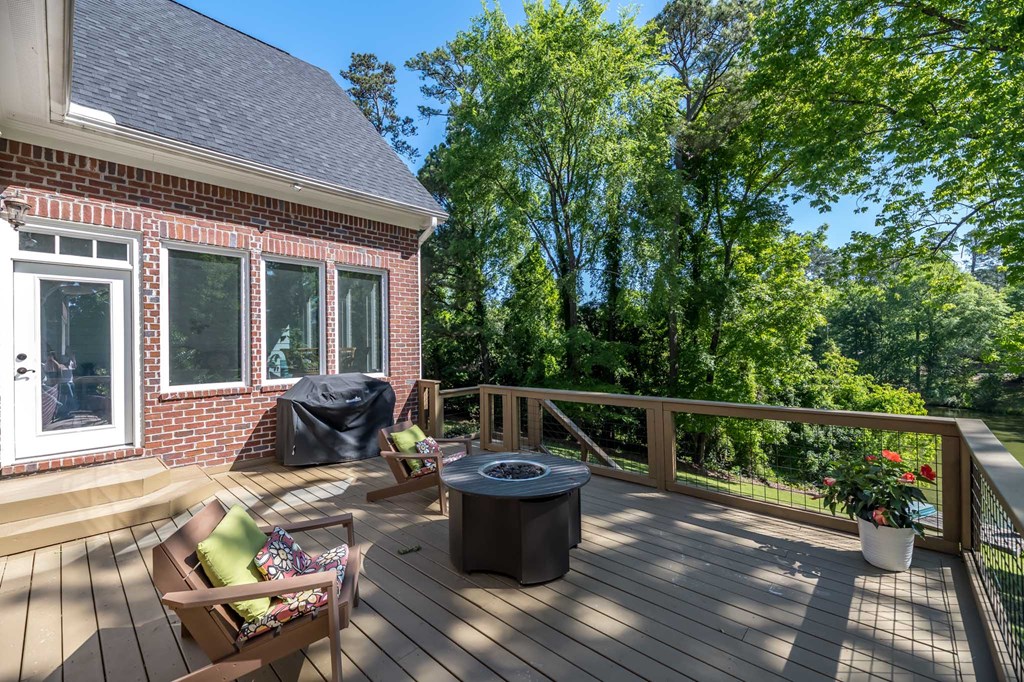 306 Cascade Road Columbus, GA 31904 - Photo 15 of 67 a view of a patio with couches chairs and wooden floor
