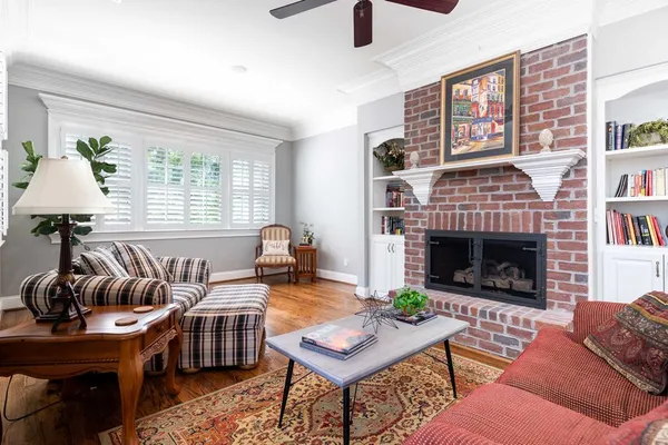 a view of a room with lots of stuff and hardwood floor