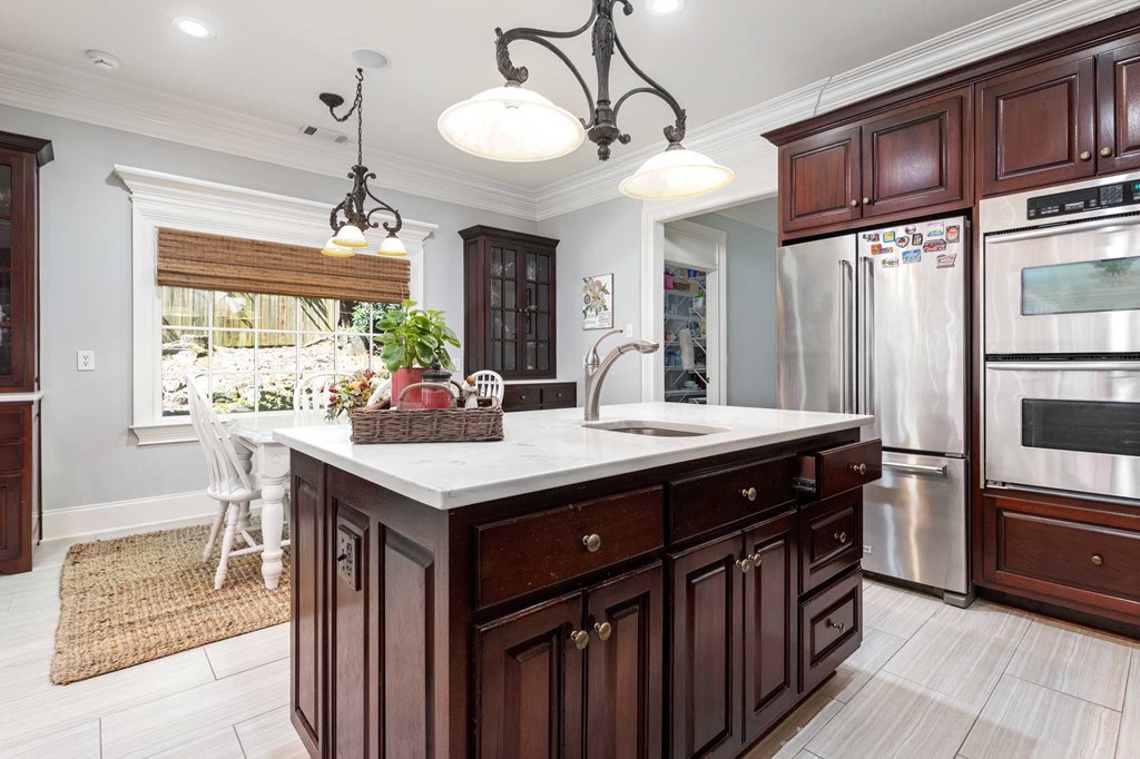 306 Cascade Road Columbus, GA 31904 - Photo 25 of 67 a kitchen with stainless steel appliances granite countertop a sink and a refrigerator