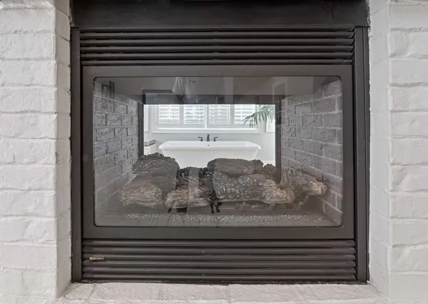 a view of a kitchen with workspace and a window
