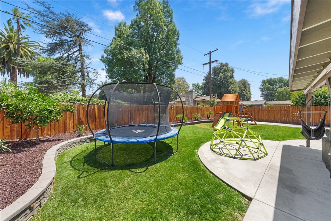 4869 Serrano Place Riverside, CA 92504 - Photo 36 of 40 Mature fruit tree adding charm and a touch of homegrown enjoyment to the backyard setting.