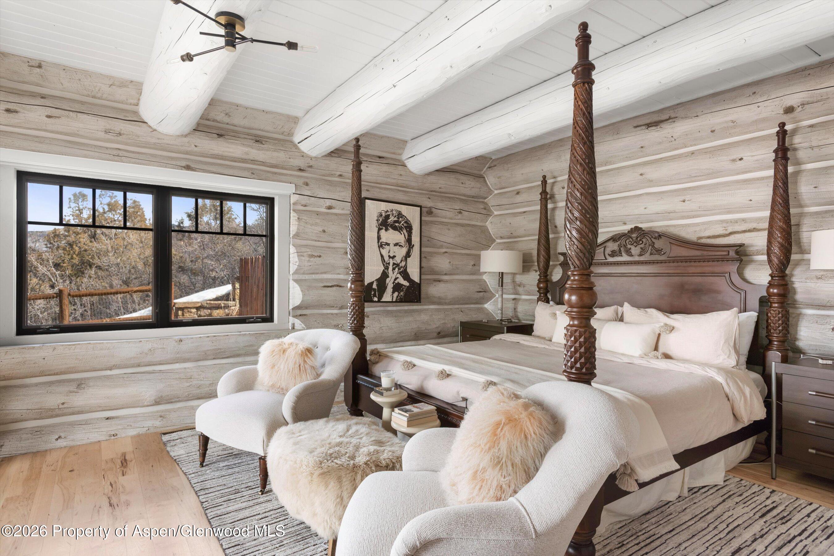 1258 Juniper Hill Road Aspen, CO 81611 - Photo 13 of 25 a bedroom with furniture and a large window