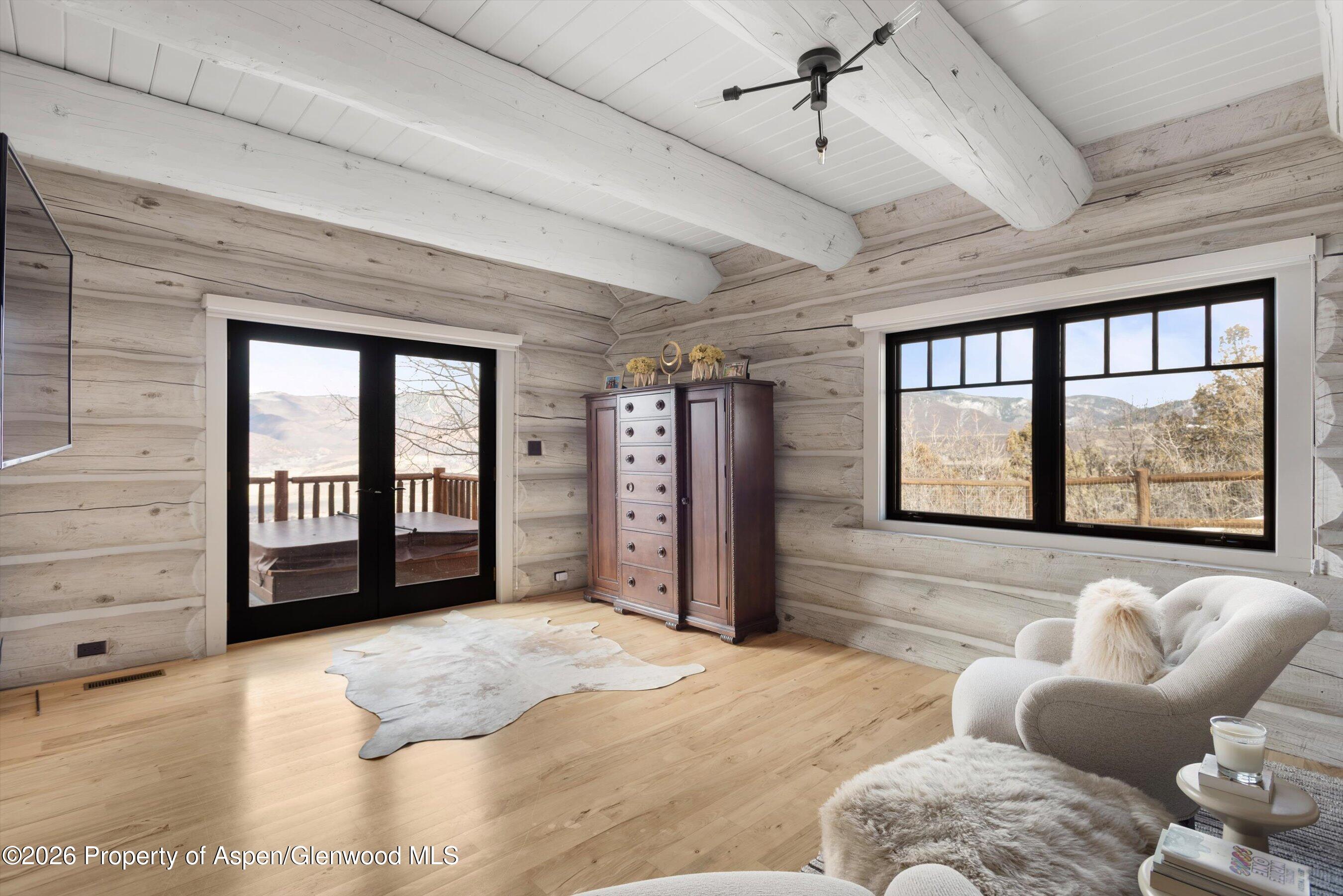 1258 Juniper Hill Road Aspen, CO 81611 - Photo 14 of 25 a bedroom with furniture and large windows