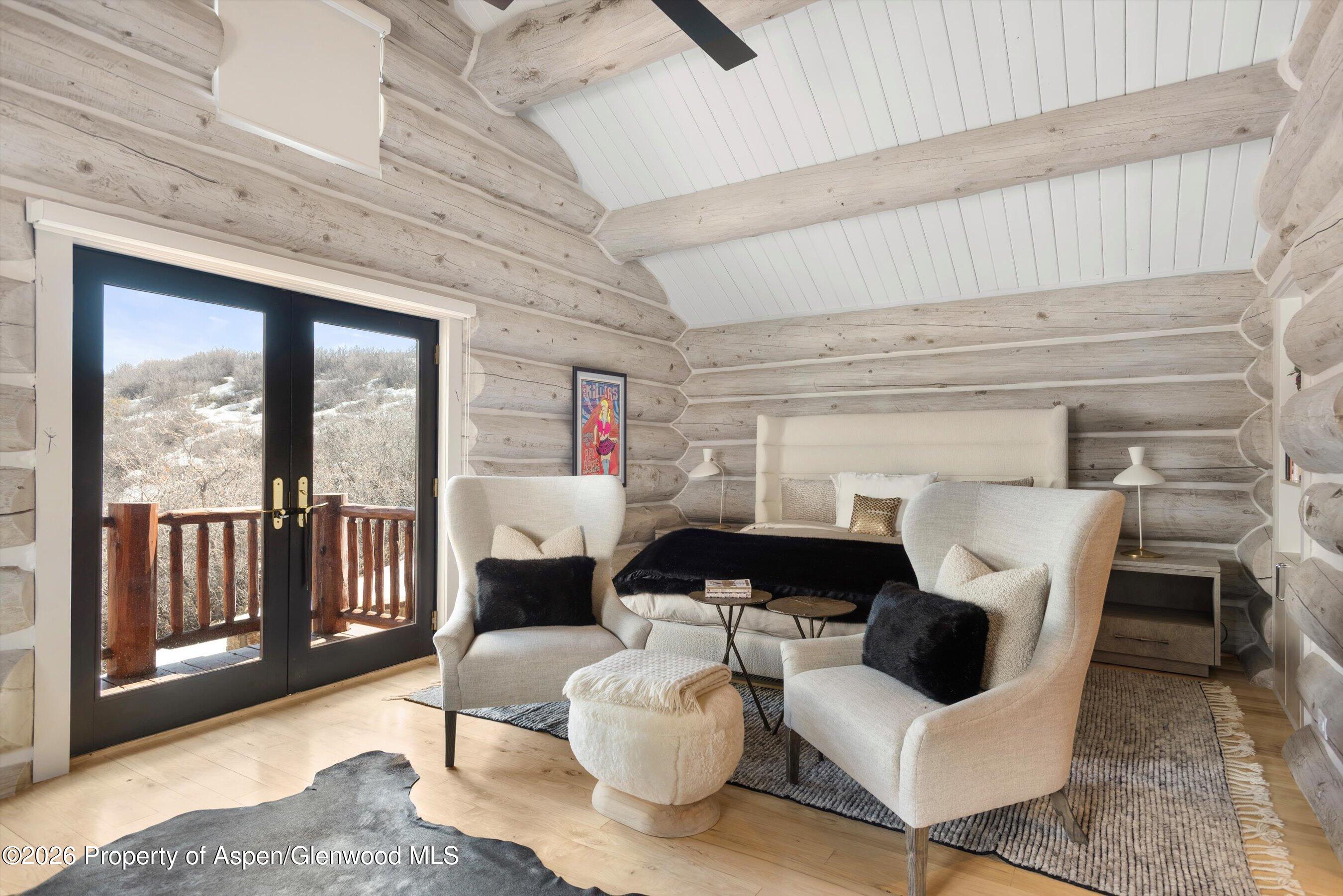 1258 Juniper Hill Road Aspen, CO 81611 - Photo 9 of 25 a living room with furniture and a floor to ceiling window