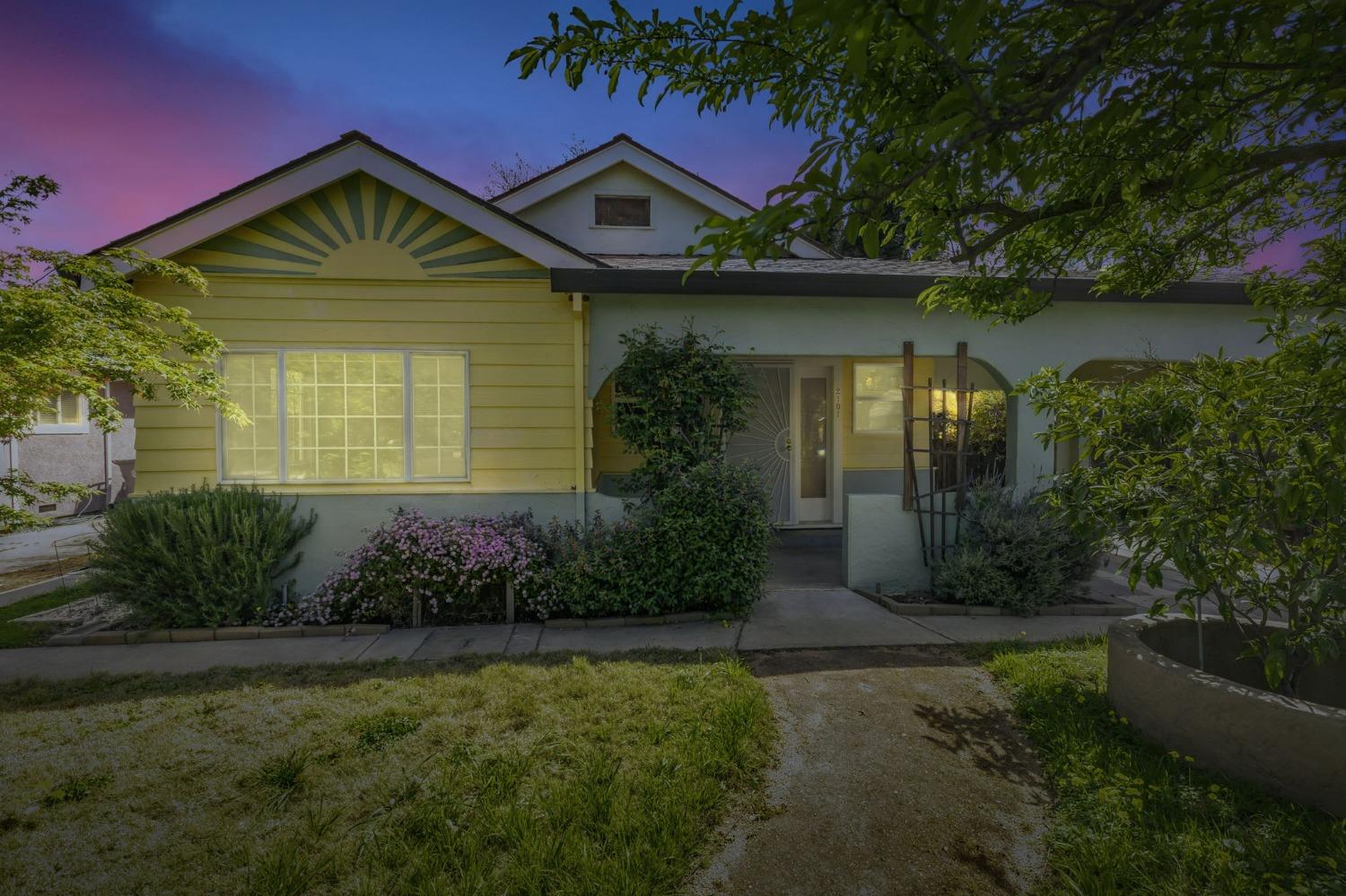 a front view of a house with garden