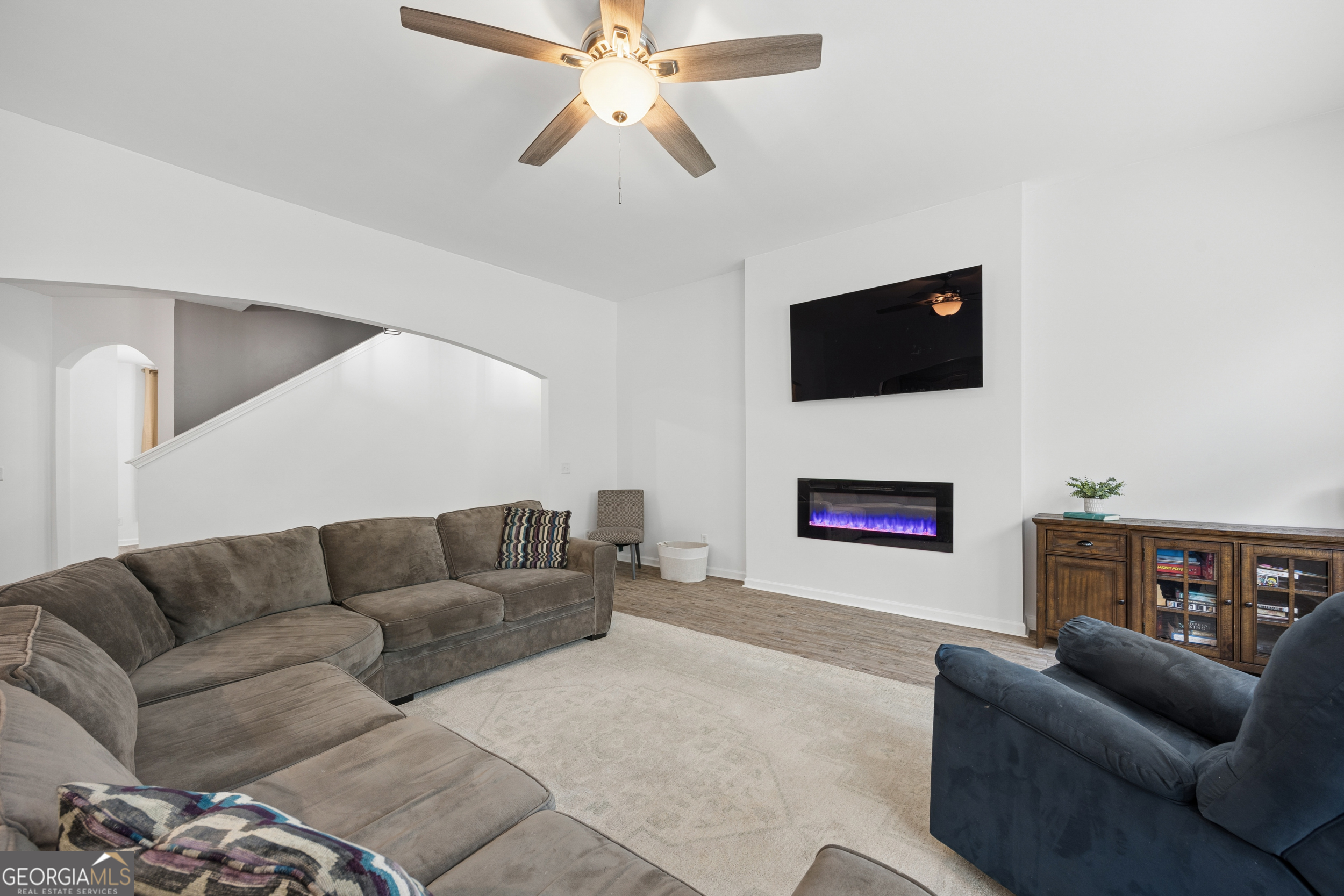 369 Waybridge Way Richmond Hill, GA 31324 - Photo 11 of 40 a living room with furniture and a flat screen tv