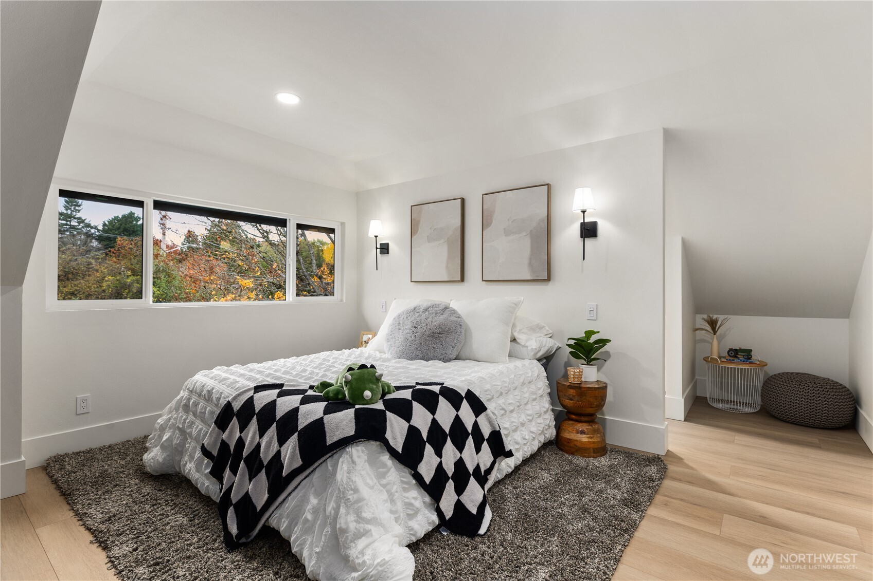 829 27th Avenue Seattle, WA 98122 - Photo 21 of 38 a bedroom with a bed and wooden floor