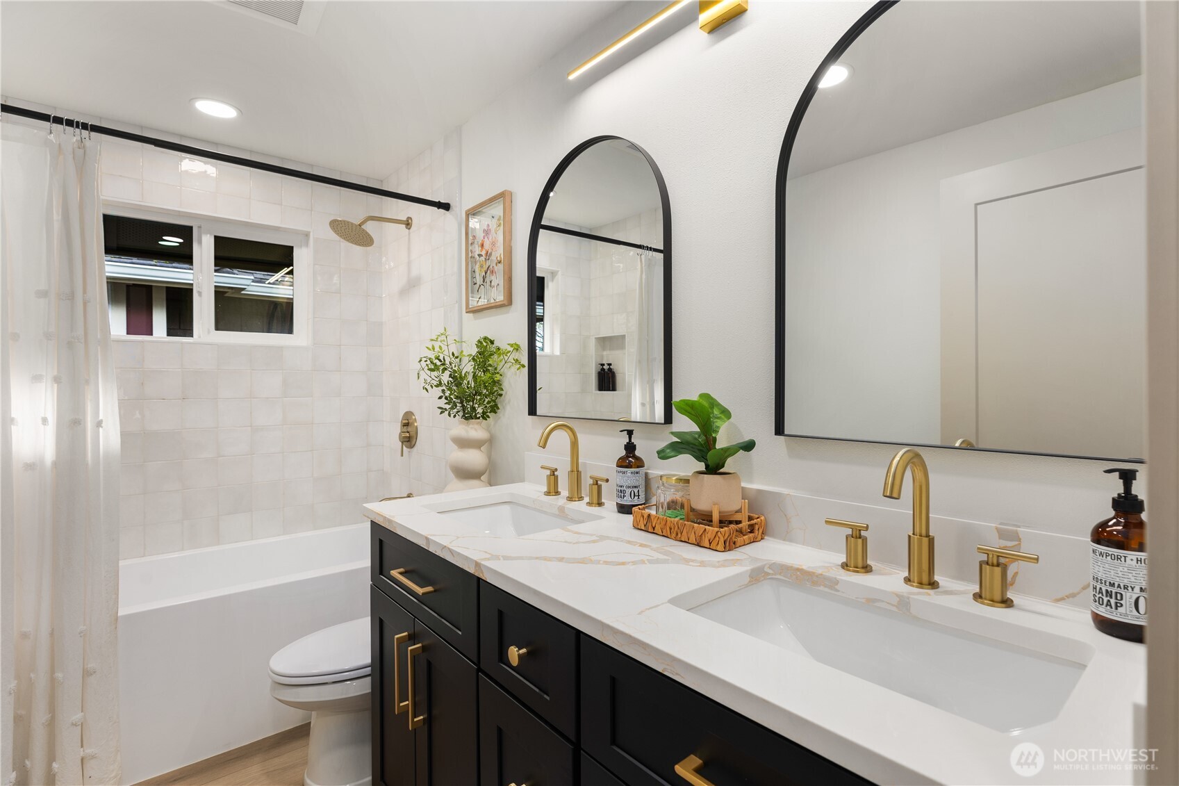 829 27th Avenue Seattle, WA 98122 - Photo 23 of 38 a bathroom with a double vanity sink and a mirror
