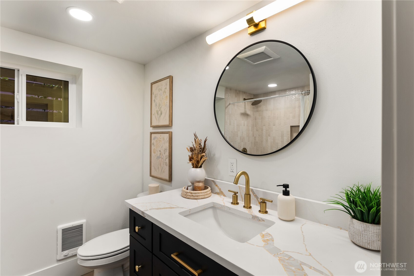 829 27th Avenue Seattle, WA 98122 - Photo 33 of 38 a bathroom with a sink a toilet and a mirror