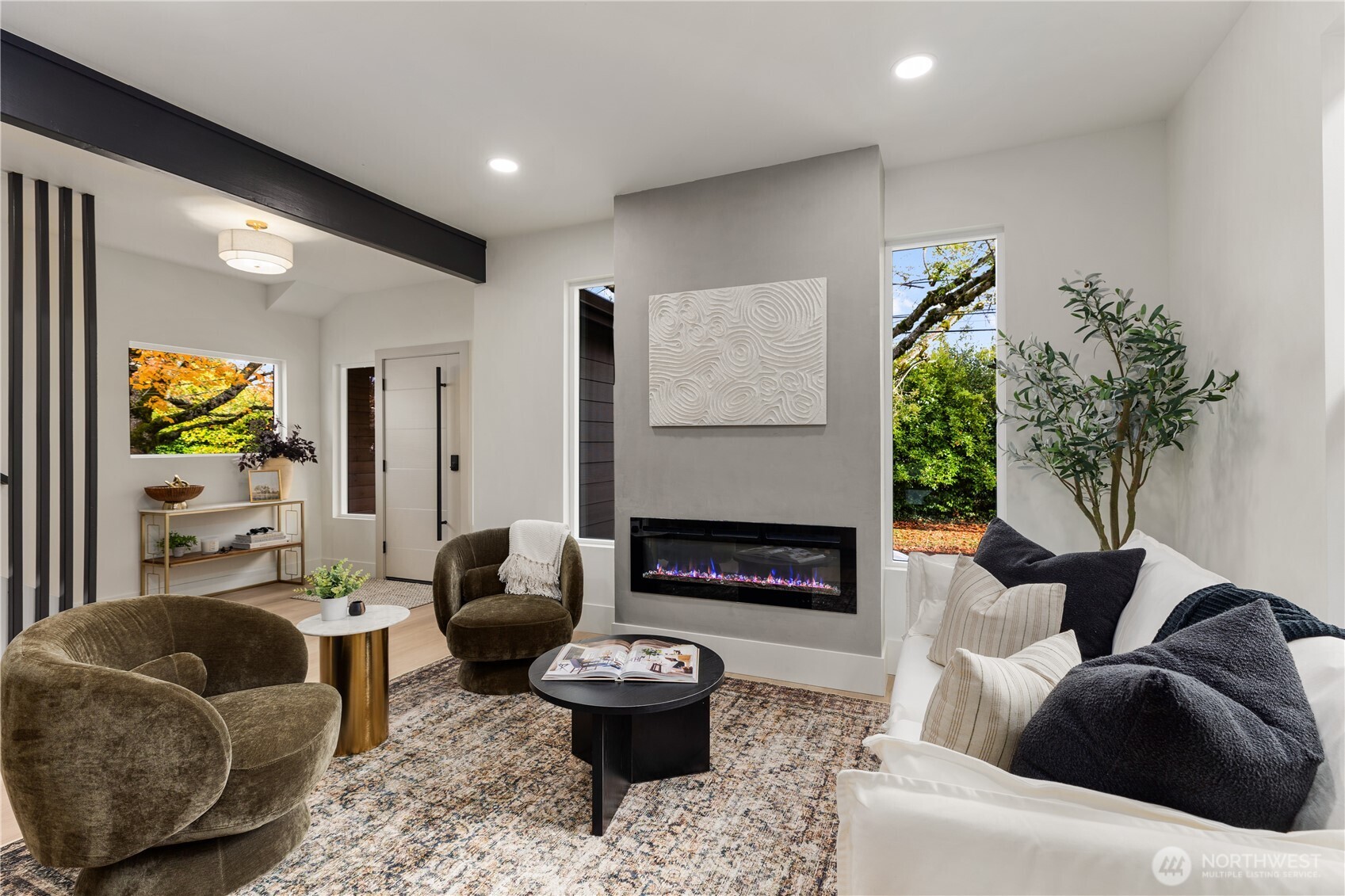 829 27th Avenue Seattle, WA 98122 - Photo 7 of 38 a living room with furniture and a fireplace