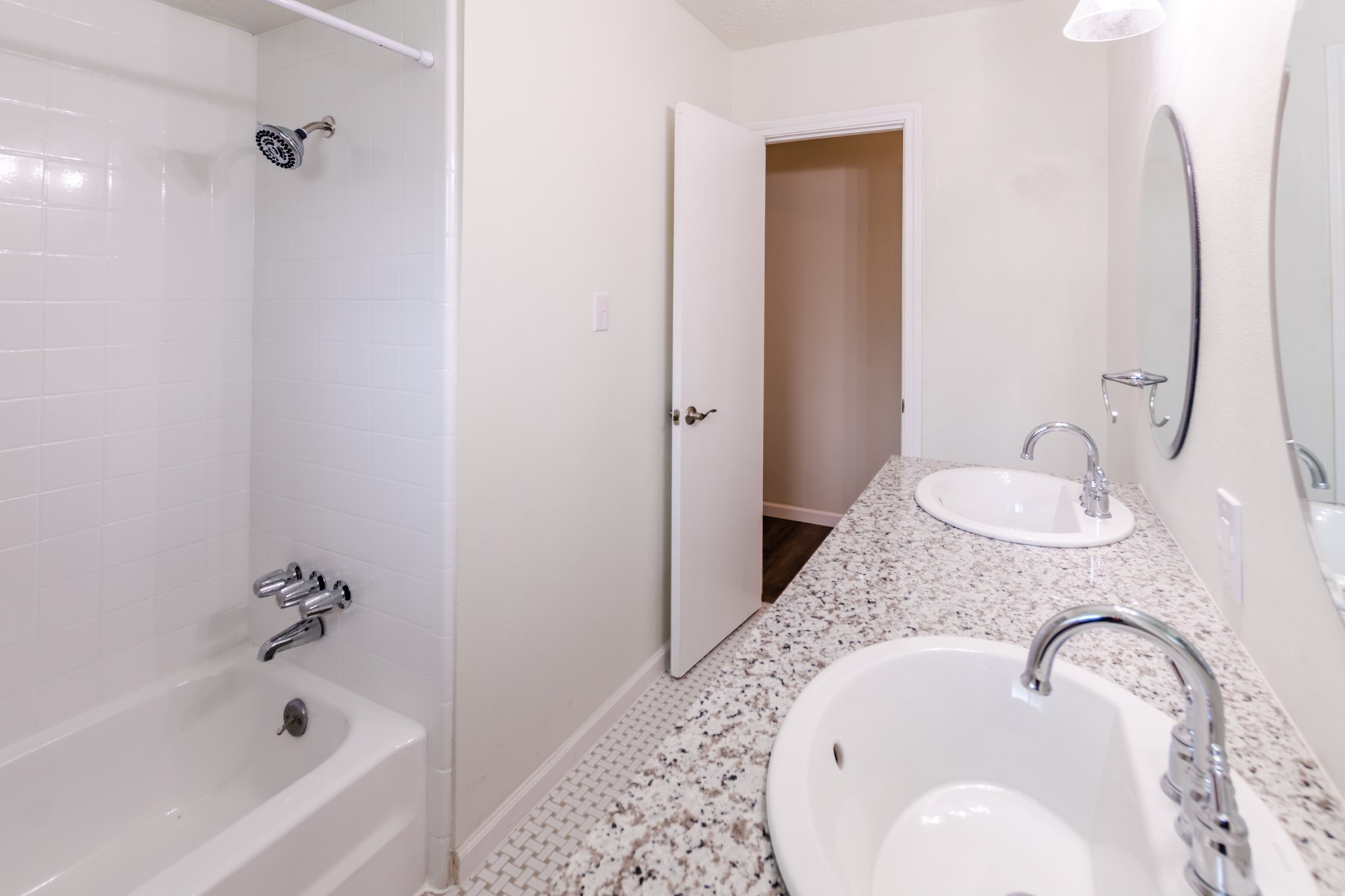9646 Springview Lane Houston, TX 77080 - Photo 21 of 32 a bathroom with a granite countertop sink and a mirror