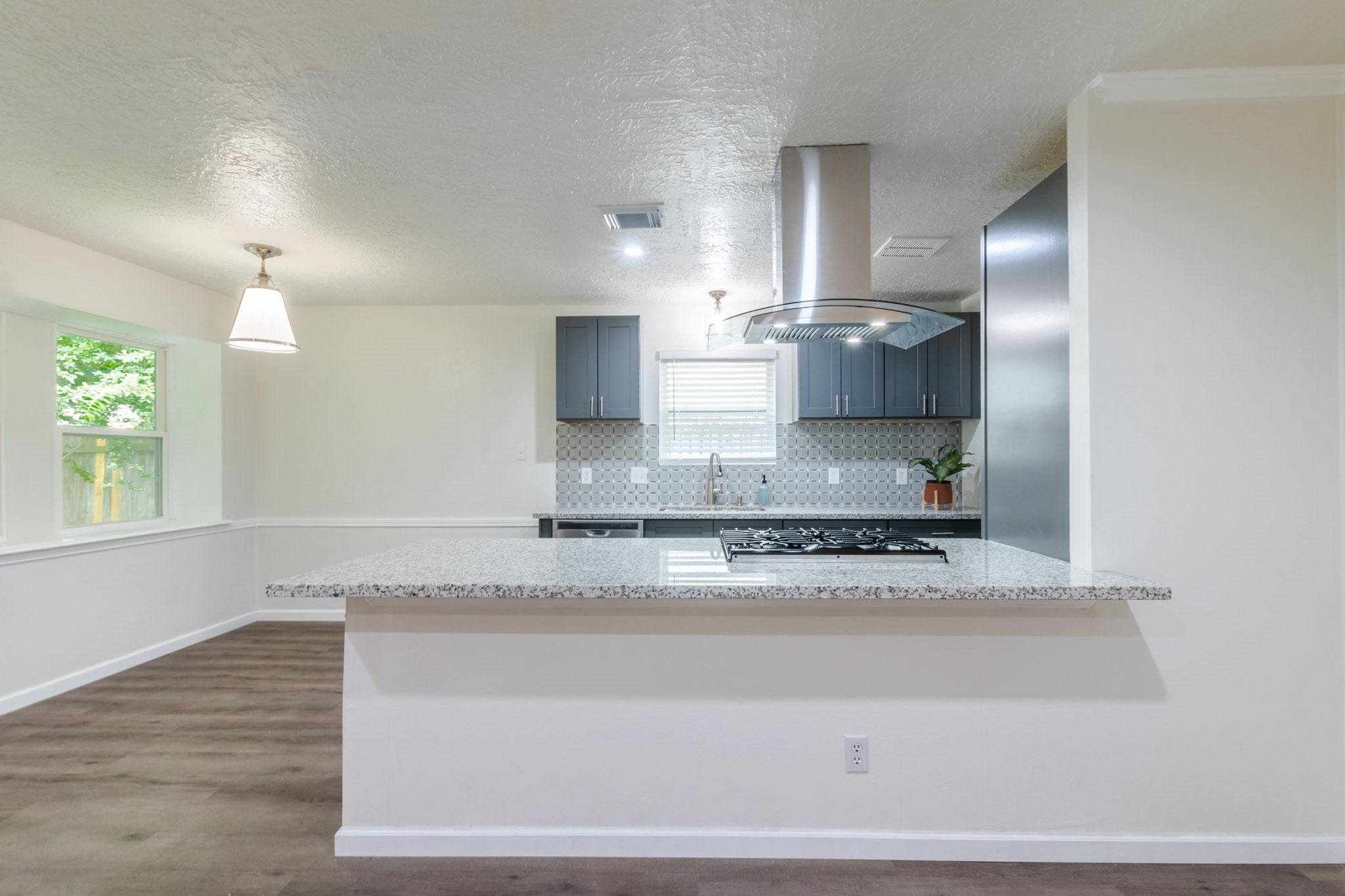 9646 Springview Lane Houston, TX 77080 - Photo 7 of 32 a kitchen with stainless steel appliances granite countertop a sink a stove and a granite counter tops