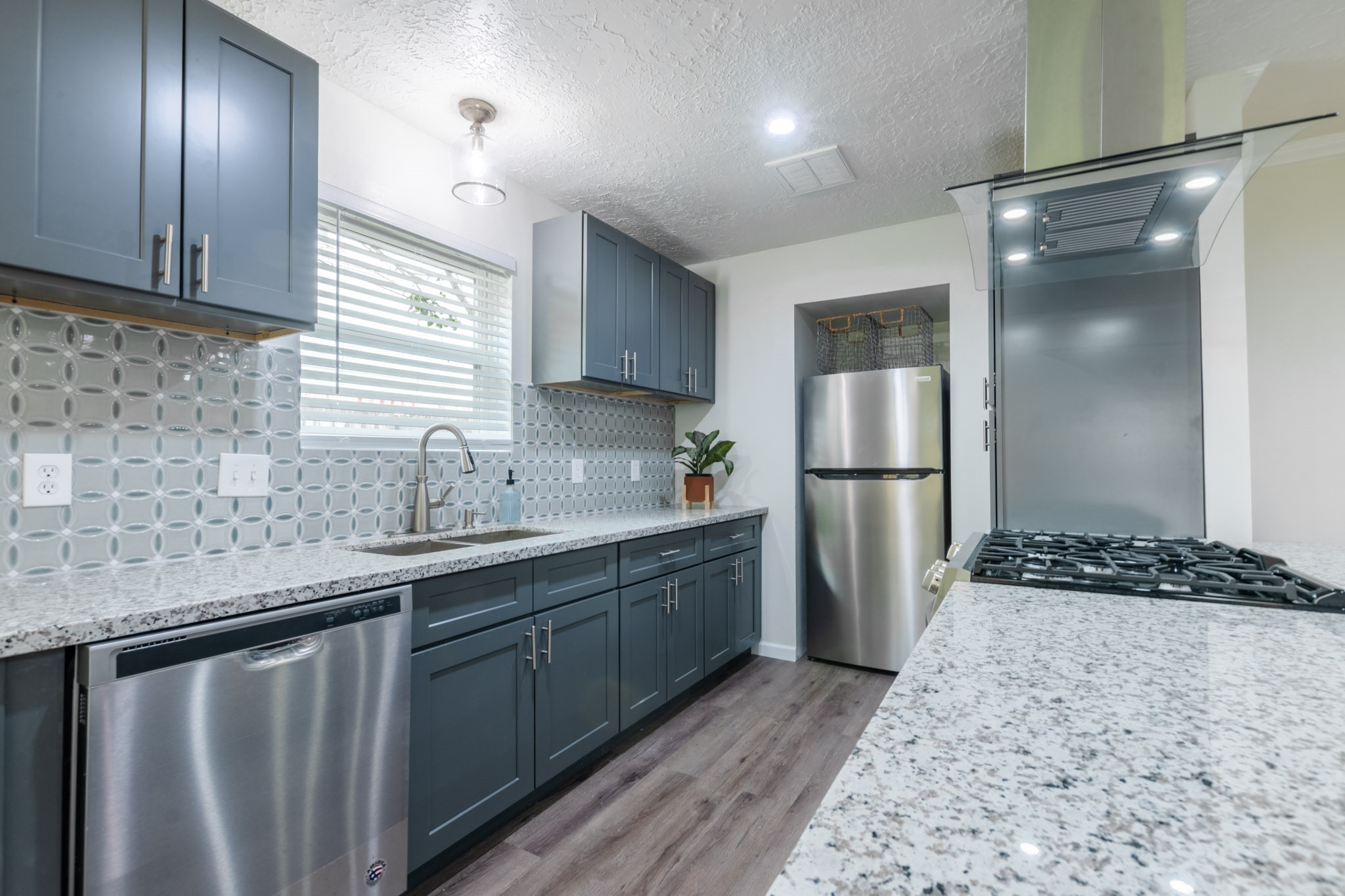 9646 Springview Lane Houston, TX 77080 - Photo 9 of 32 a kitchen with stainless steel appliances granite countertop a refrigerator and a sink