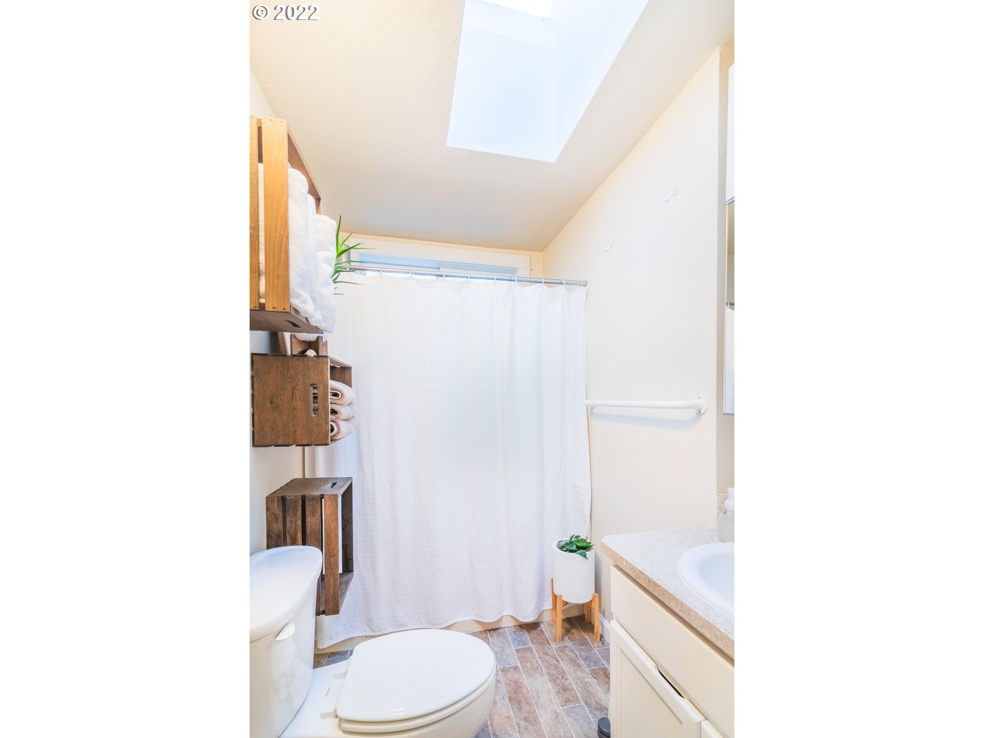11910 Southwest Denney Road Beaverton, OR 97008 - Photo 12 of 22 a bathroom with a toilet a sink and a shower