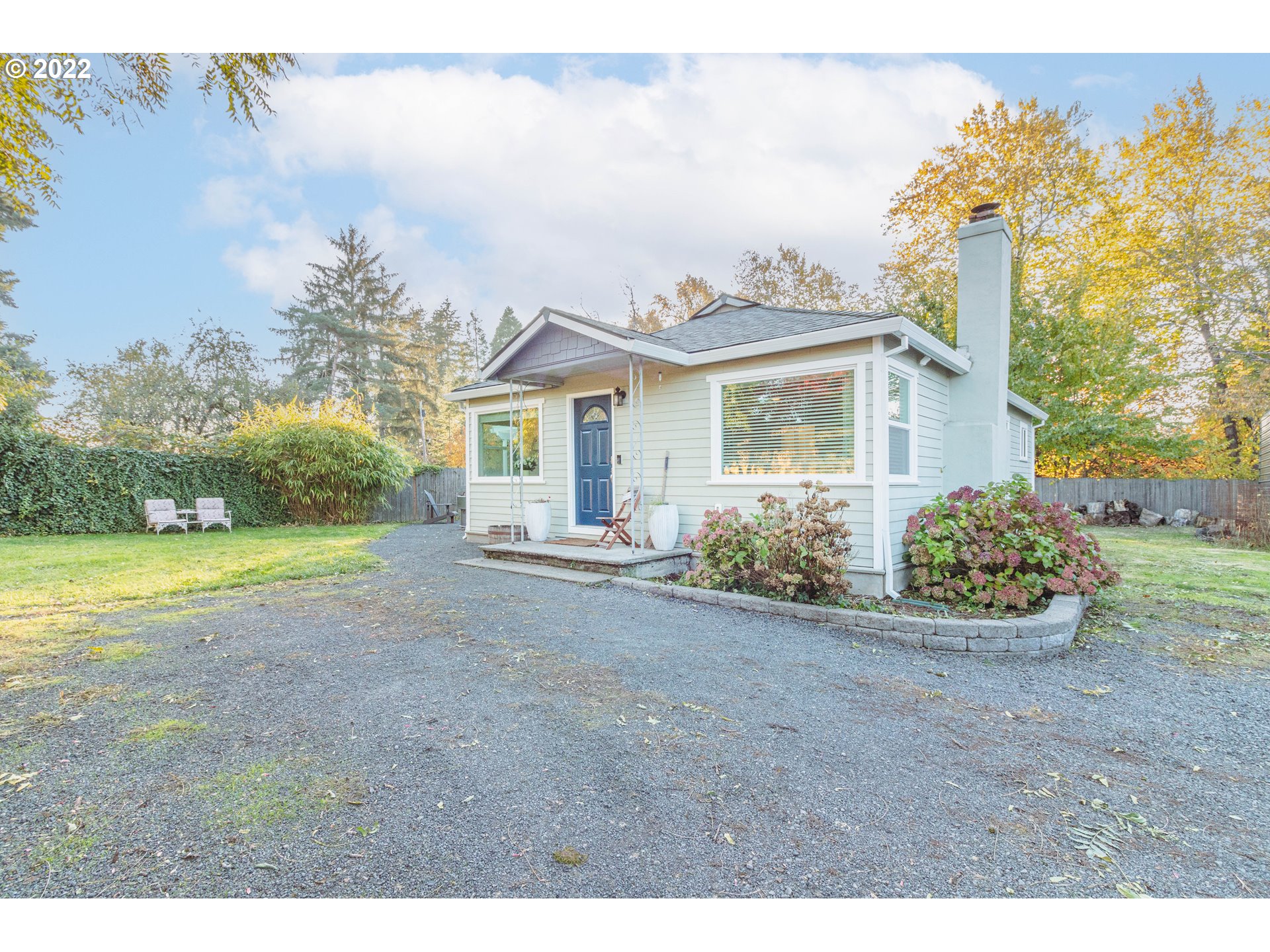 11910 Southwest Denney Road Beaverton, OR 97008 - Photo 17 of 22 a view of a house with yard and a garden