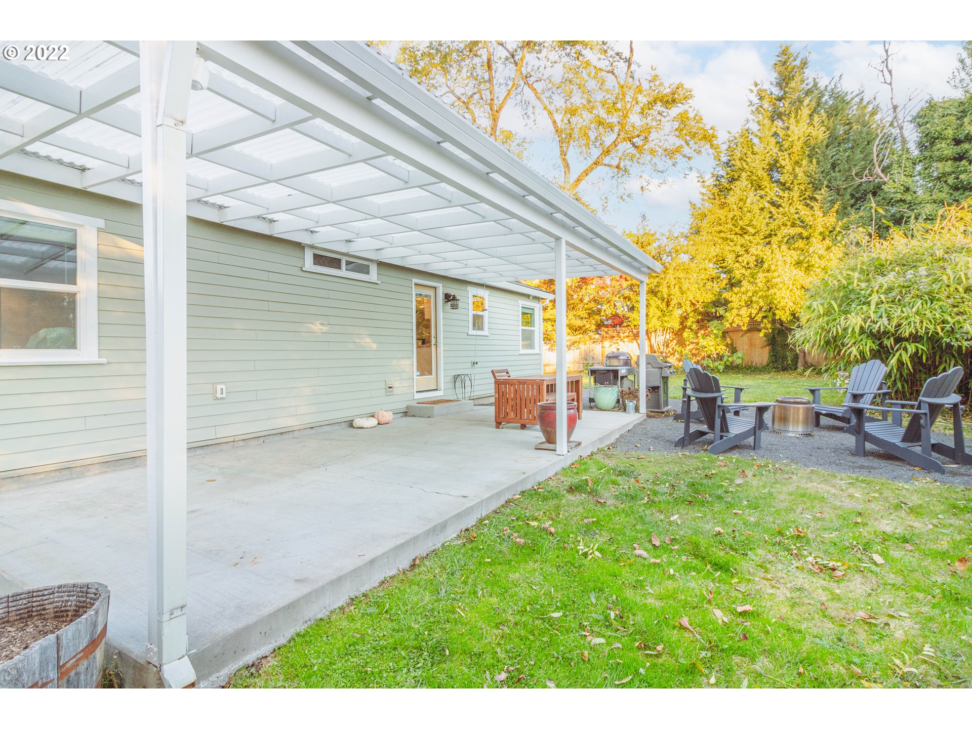 11910 Southwest Denney Road Beaverton, OR 97008 - Photo 19 of 22 a view of back yard of the house with outdoor seating