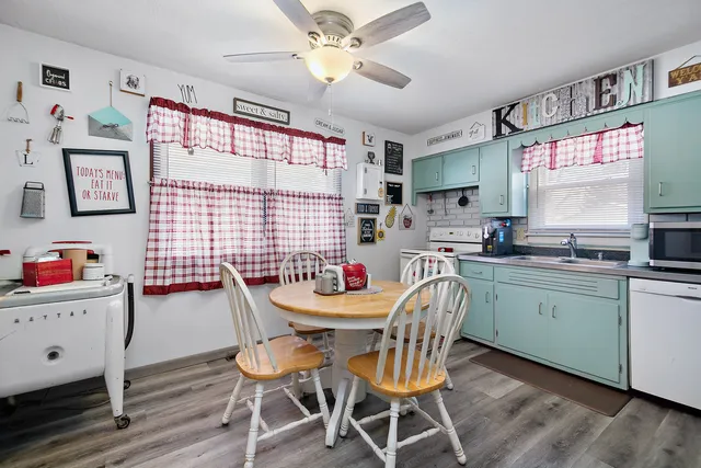 a dining room with furniture and window