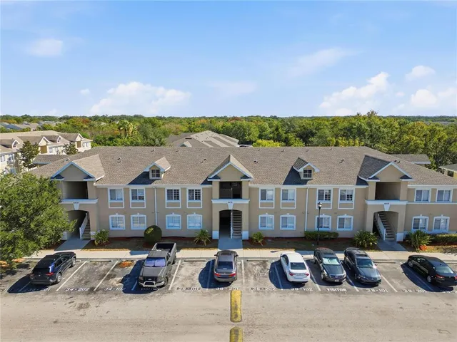 a front view of a house with sitting area