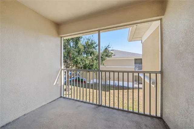 a view of a porch with a floor to ceiling window
