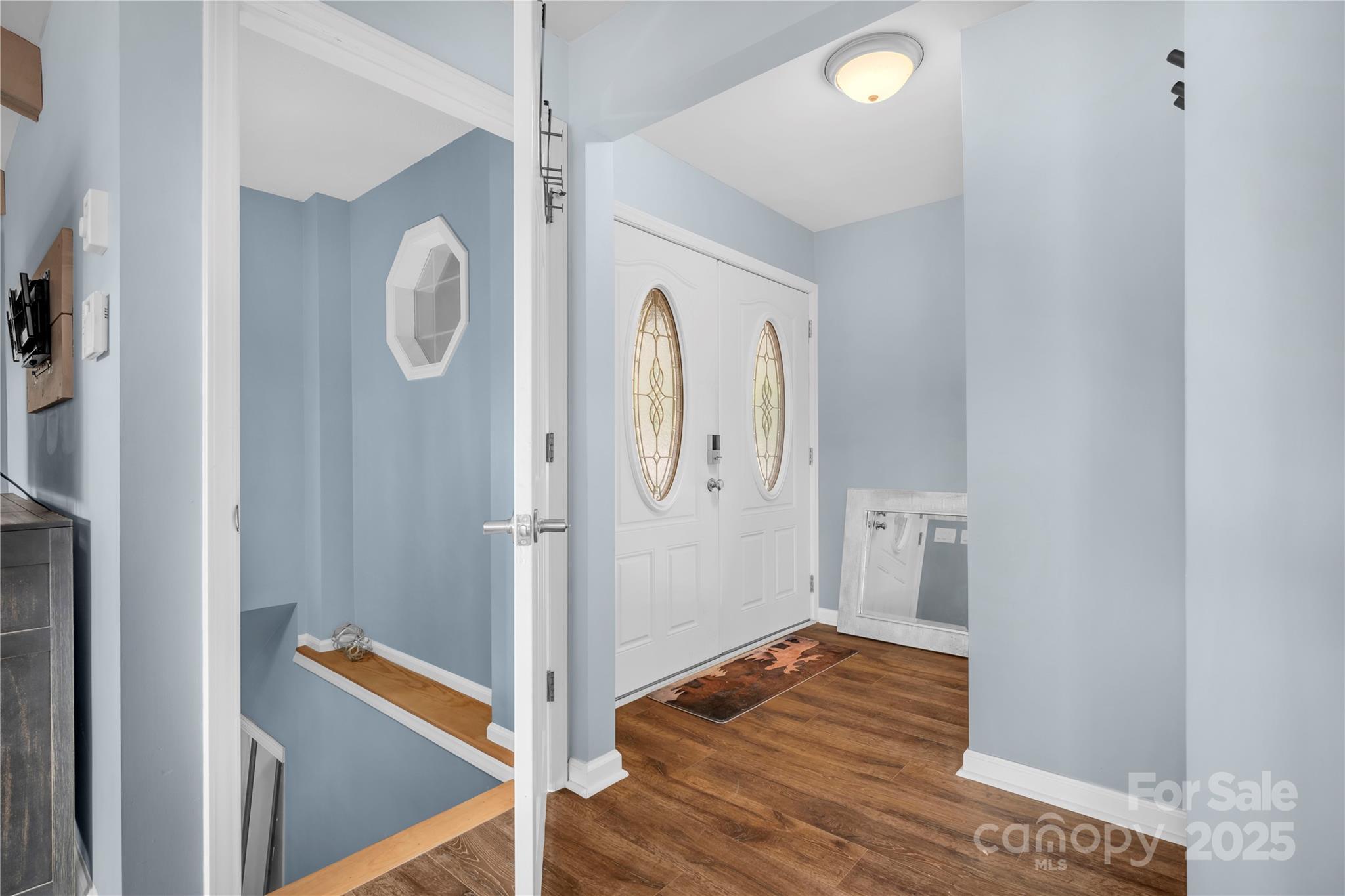 555 Glenview Road Newland, NC 28657 - Photo 12 of 48 a view of a hallway with wooden floor