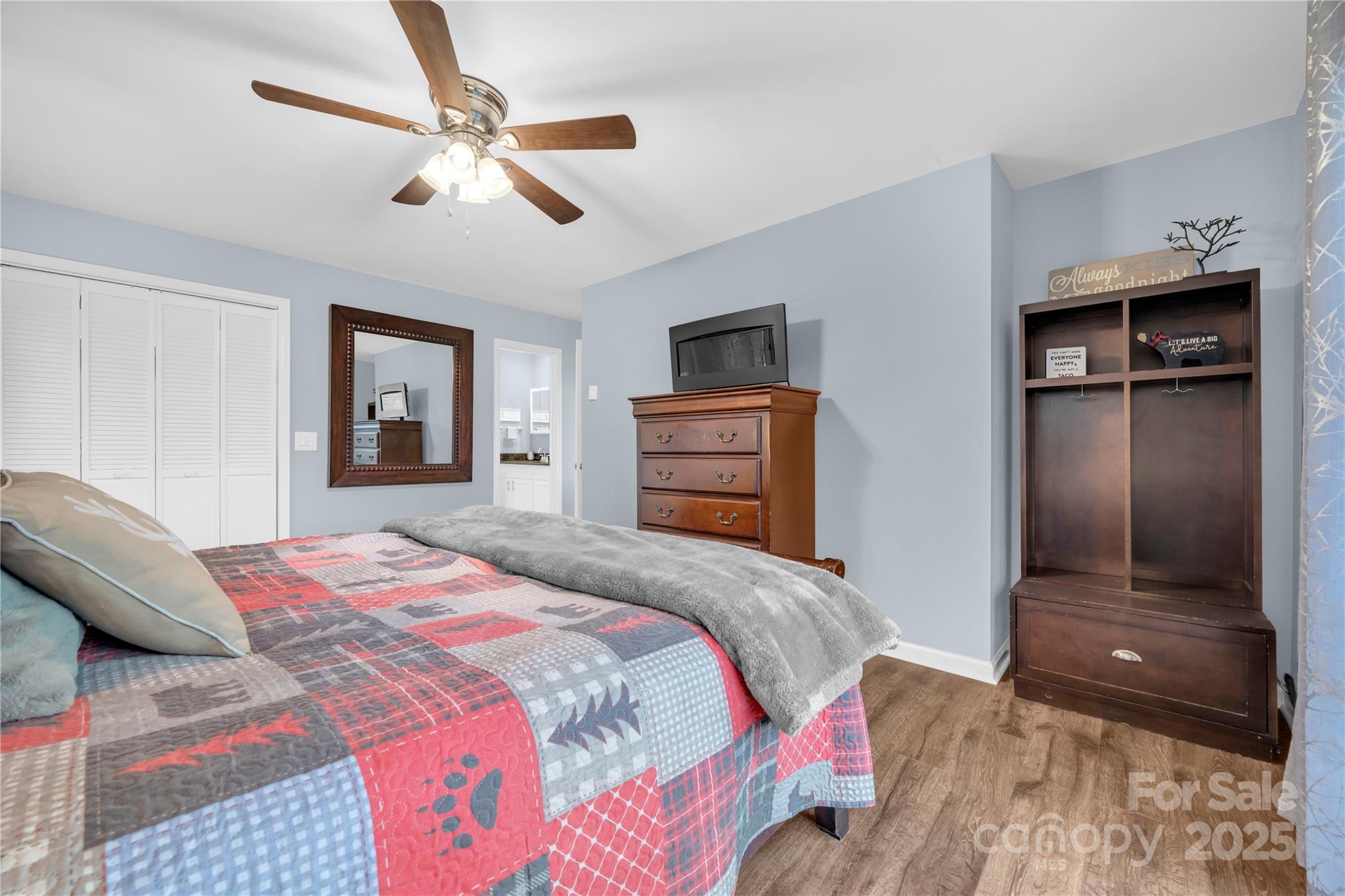 555 Glenview Road Newland, NC 28657 - Photo 14 of 48 a bedroom with a bed and a walk in closet