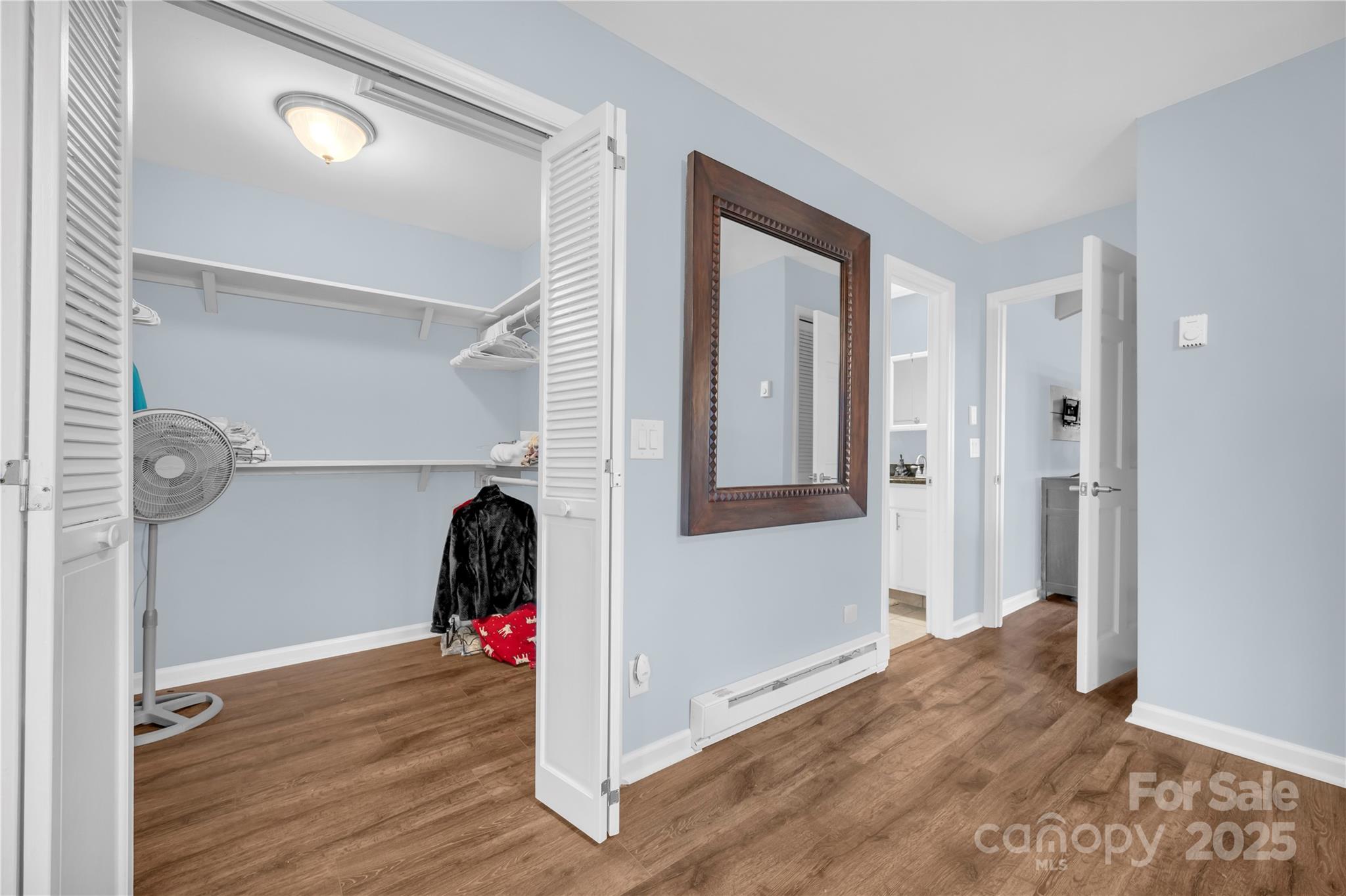 555 Glenview Road Newland, NC 28657 - Photo 16 of 48 a view of a room with wooden floor and ceiling fan