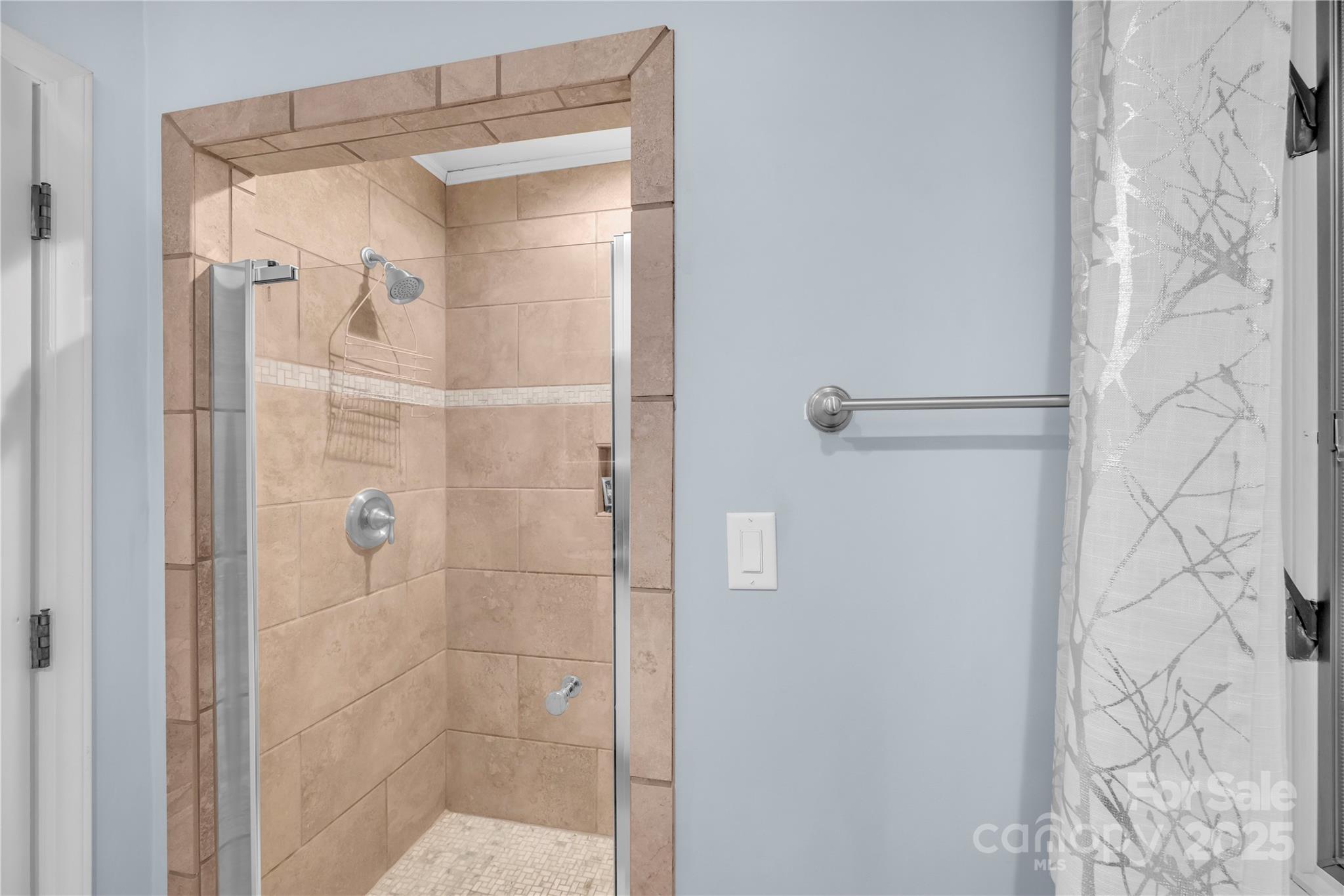 555 Glenview Road Newland, NC 28657 - Photo 18 of 48 a bathroom with a glass shower door