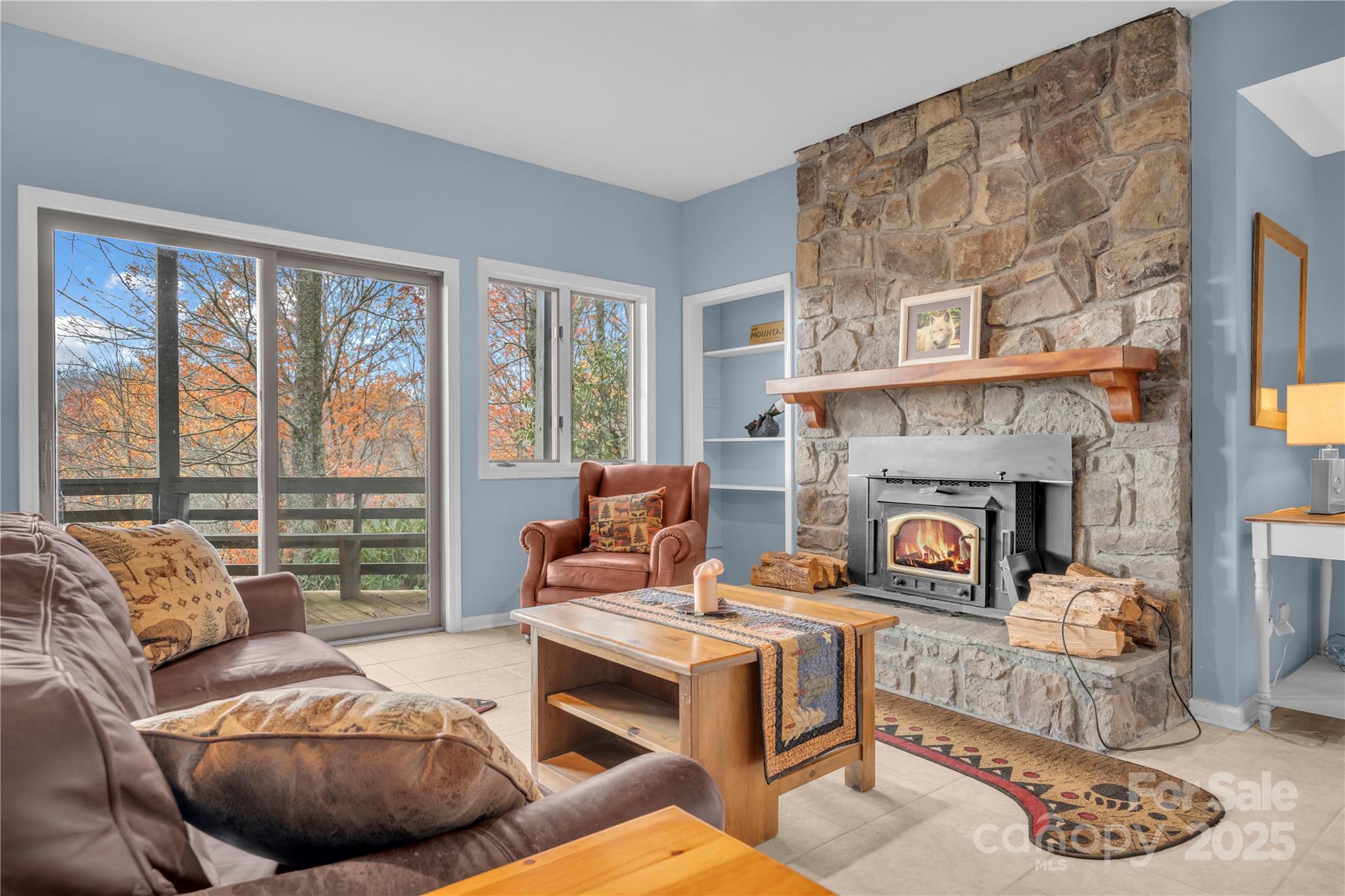 555 Glenview Road Newland, NC 28657 - Photo 25 of 48 a living room with furniture and a fireplace