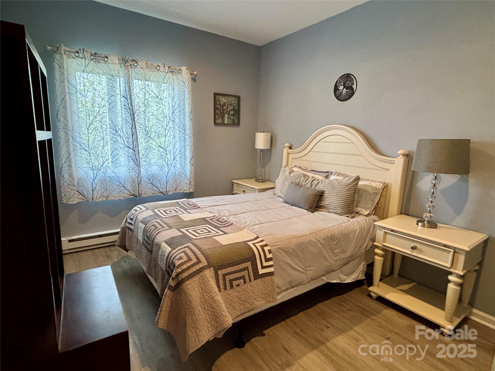 555 Glenview Road Newland, NC 28657 - Photo 28 of 48 a bedroom with a bed and a window