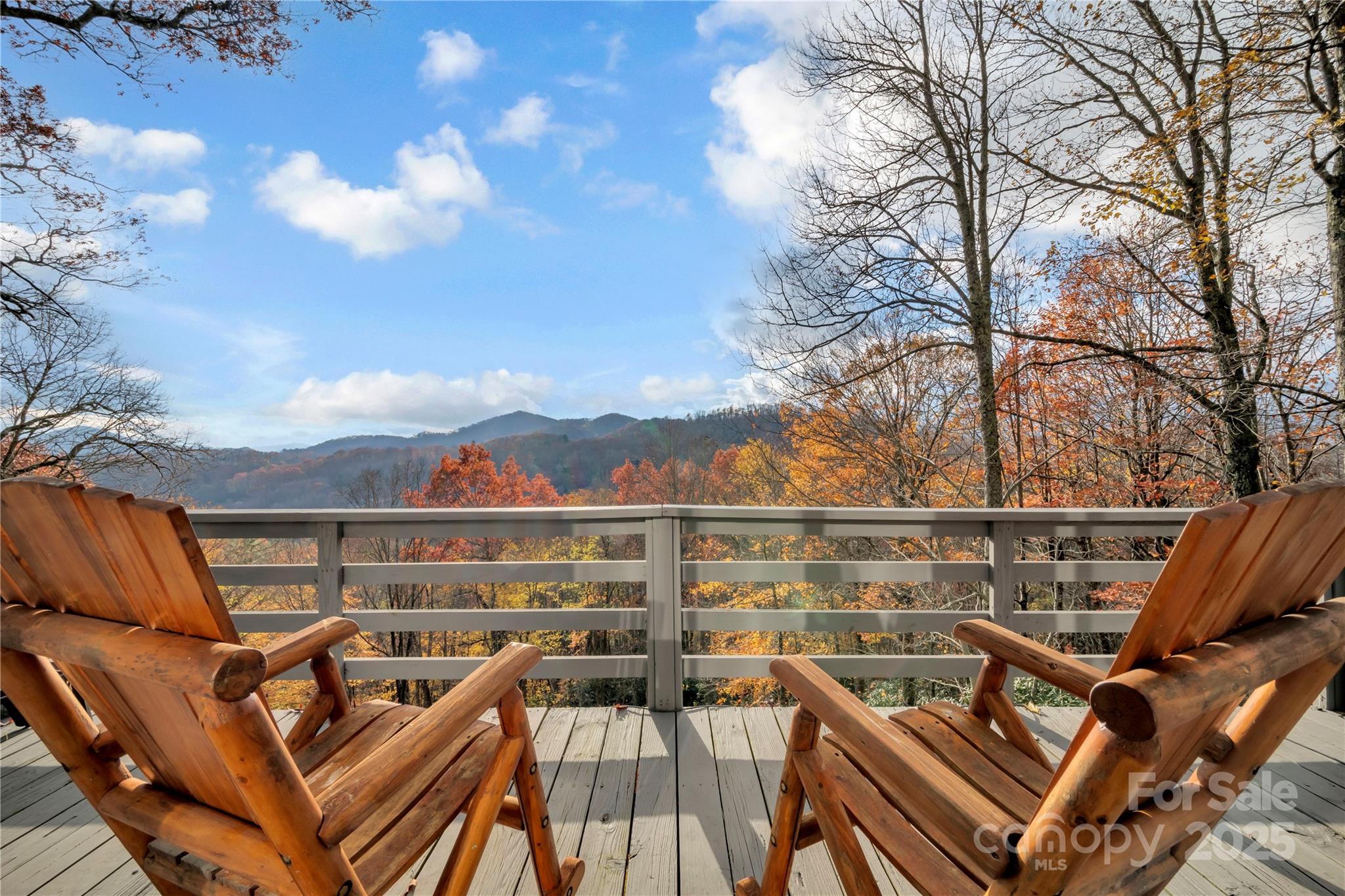 555 Glenview Road Newland, NC 28657 - Photo 3 of 48 a view of a terrace with couches and wooden fence