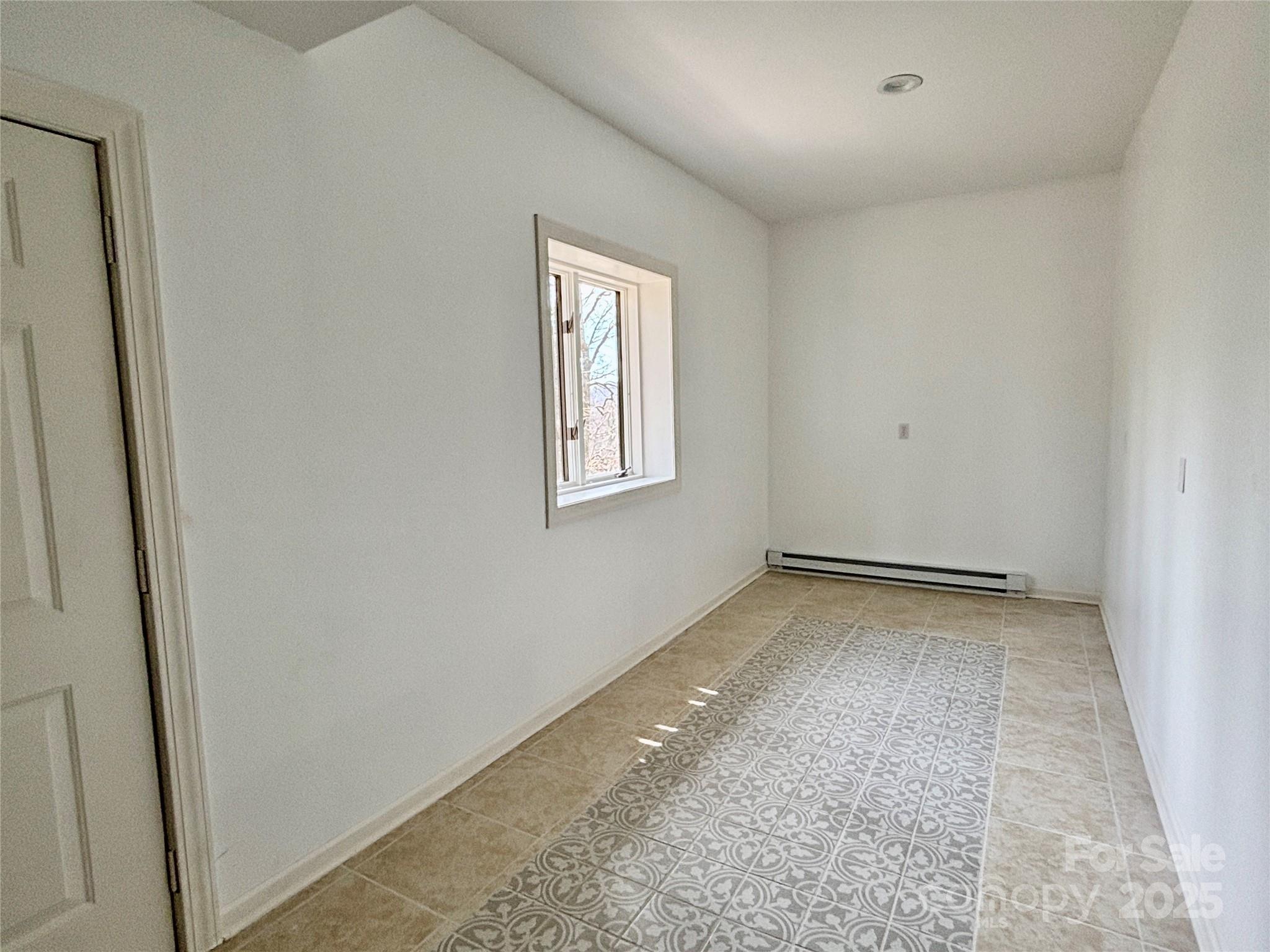 555 Glenview Road Newland, NC 28657 - Photo 34 of 48 a view of a room that has a window in it