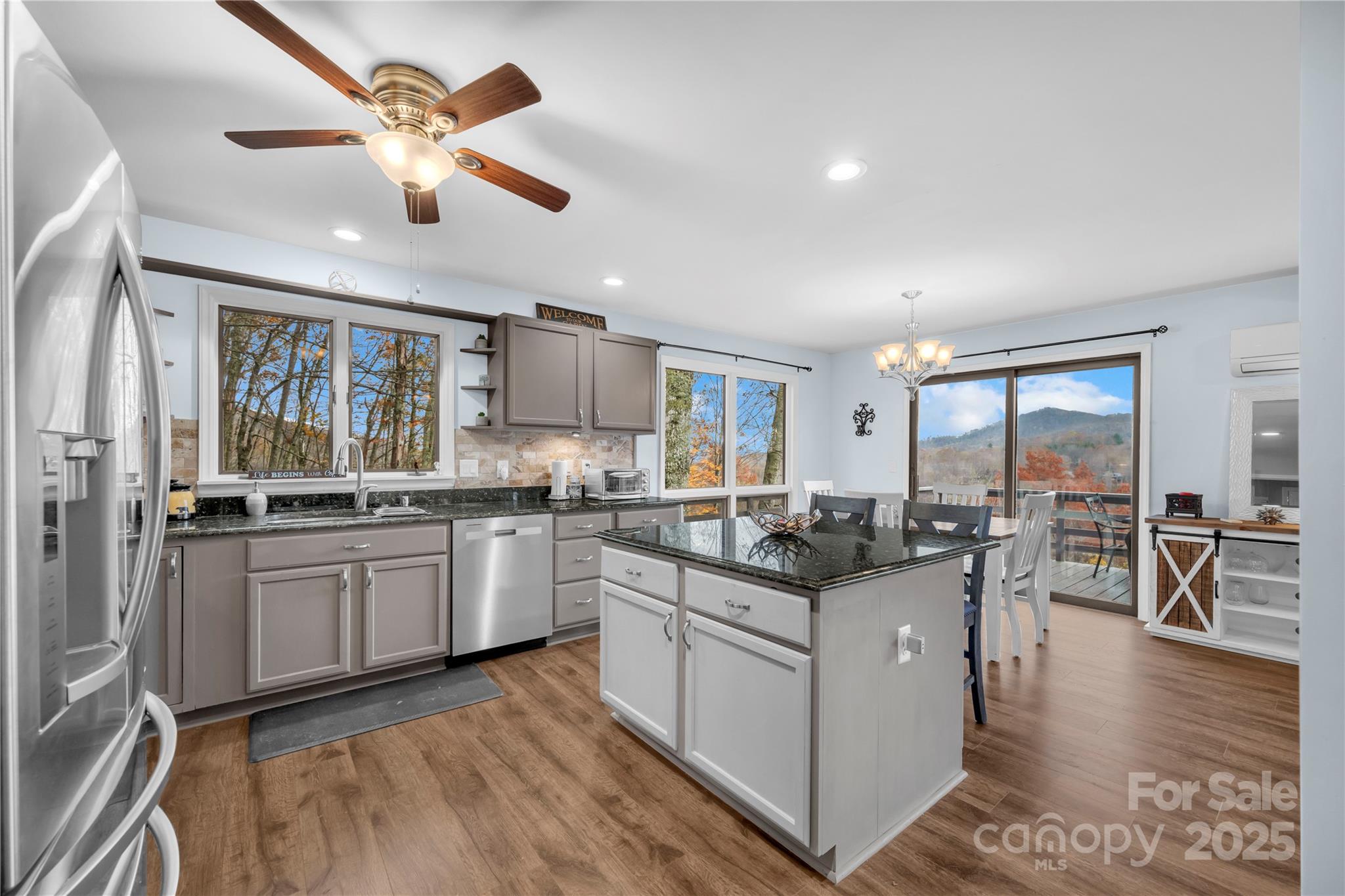555 Glenview Road Newland, NC 28657 - Photo 8 of 48 a kitchen with stainless steel appliances granite countertop a stove oven and a refrigerator