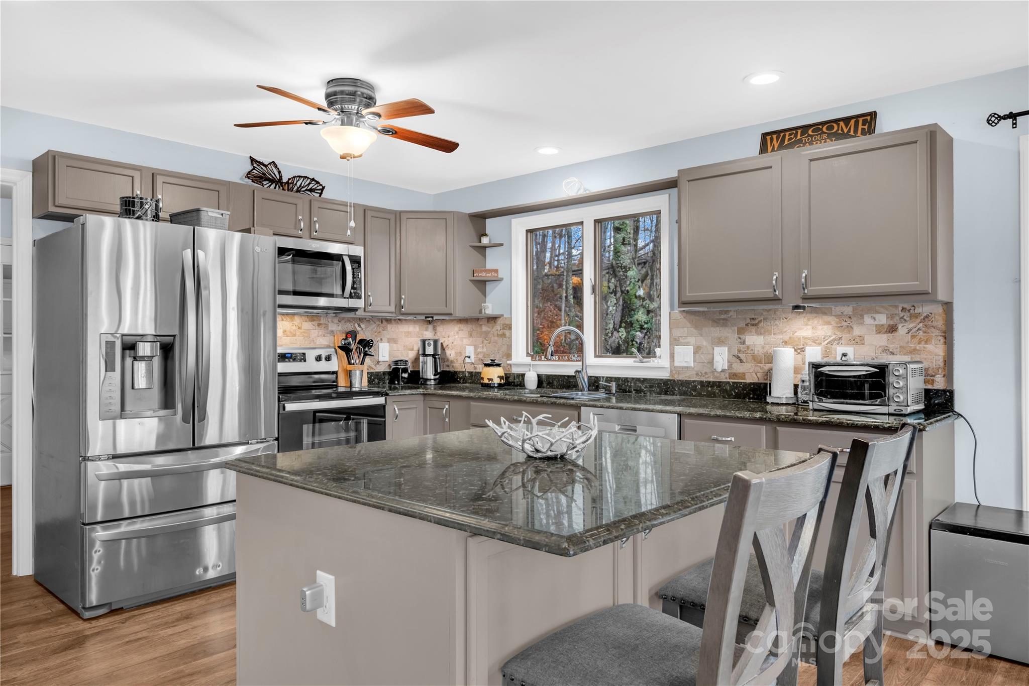 555 Glenview Road Newland, NC 28657 - Photo 9 of 48 a kitchen with kitchen island a counter top space appliances and a center island