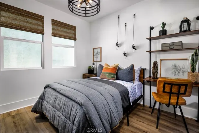 a bedroom with bed and a window