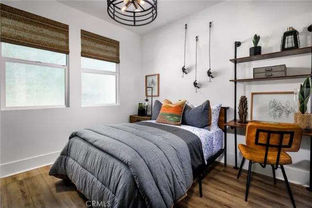 a bedroom with bed and a window